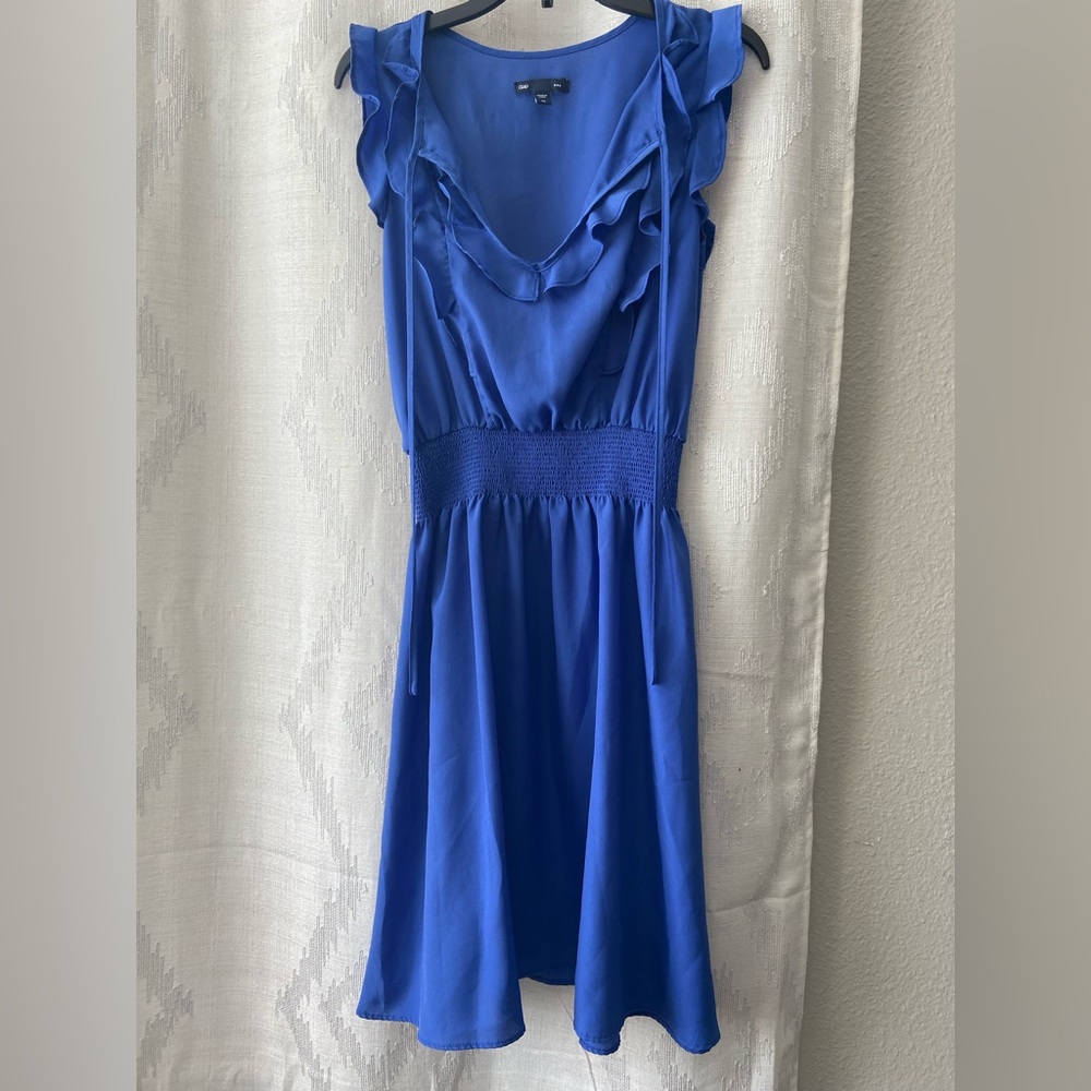 Royal blue mini ruffled dress winched at the waist.